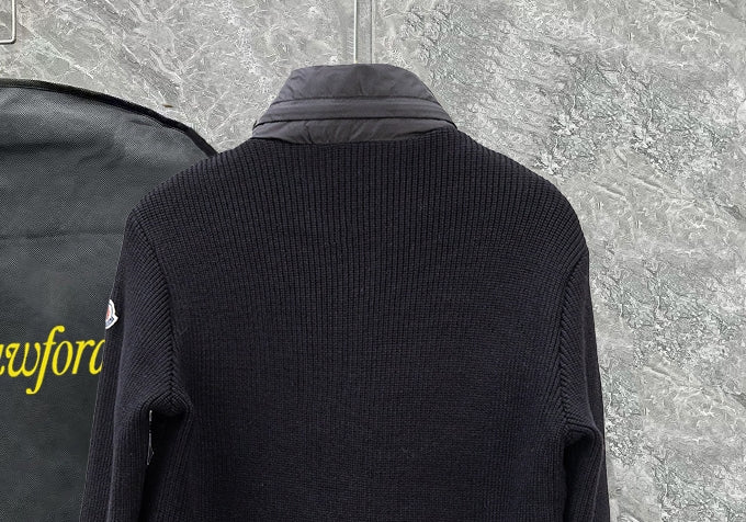 Moncler long black puffer jacket close-up of knit-textured back collar