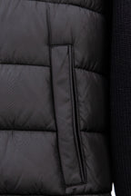 Moncler long black puffer jacket close-up of center zip placket panel