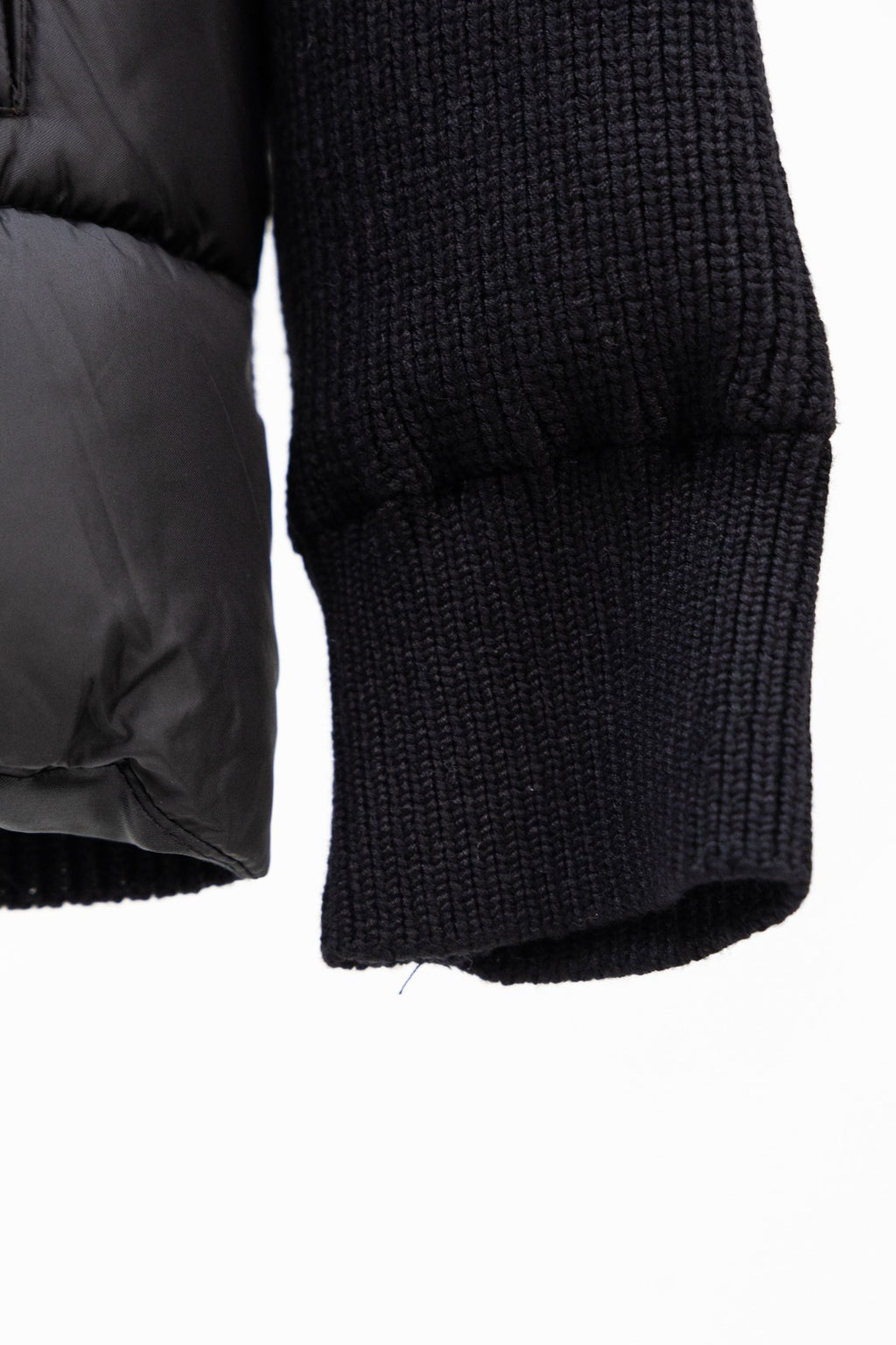 Moncler long black puffer jacket sleeve end with knit cuff