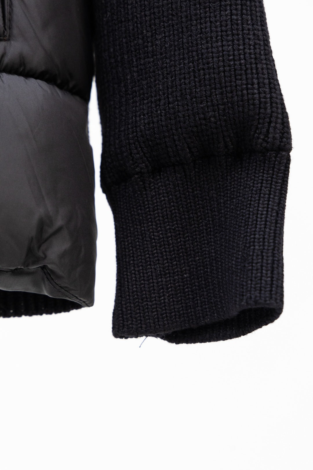 Moncler long black puffer jacket sleeve end with knit cuff