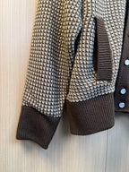 Two-tone knit cardigan sleeve with houndstooth pattern and dark ribbed cuff