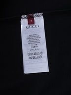 Black Gucci garment with size and care label tag, made in Italy