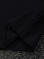 Gucci short-sleeve T-shirt sleeve seam detail, black fabric close-up