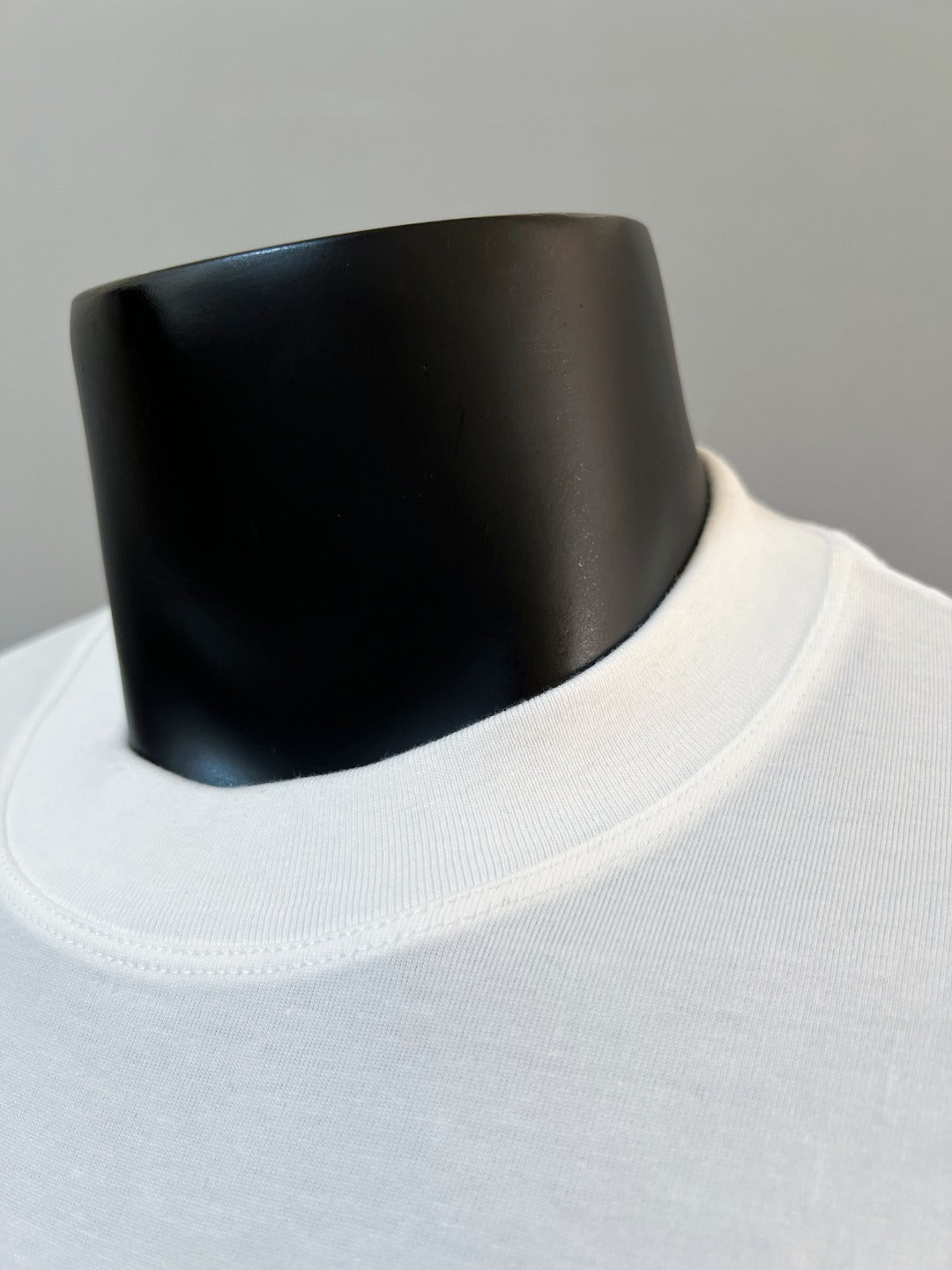 White crew-neck T-shirt collar close-up