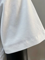 White T-shirt sleeve and hem close-up