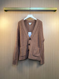 Brown knit cardigan with button front and V-neck, ribbed cuffs and hem