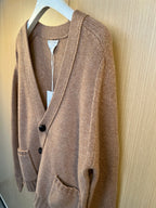 Brown knit cardigan with long sleeves, button front, and ribbed trim