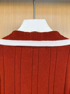 Rust red ribbed cardigan back with white collar band trim
