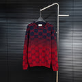Dark navy knit sweater with red GG monogram pattern, crew neck, long sleeves.