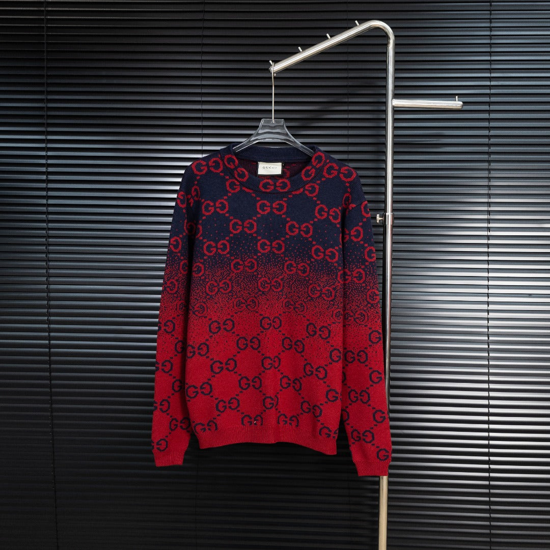 Dark navy knit sweater with red GG monogram pattern, crew neck, long sleeves.
