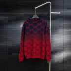 Dark navy knit sweater with red GG monogram all-over pattern, crew neck, long sleeves.