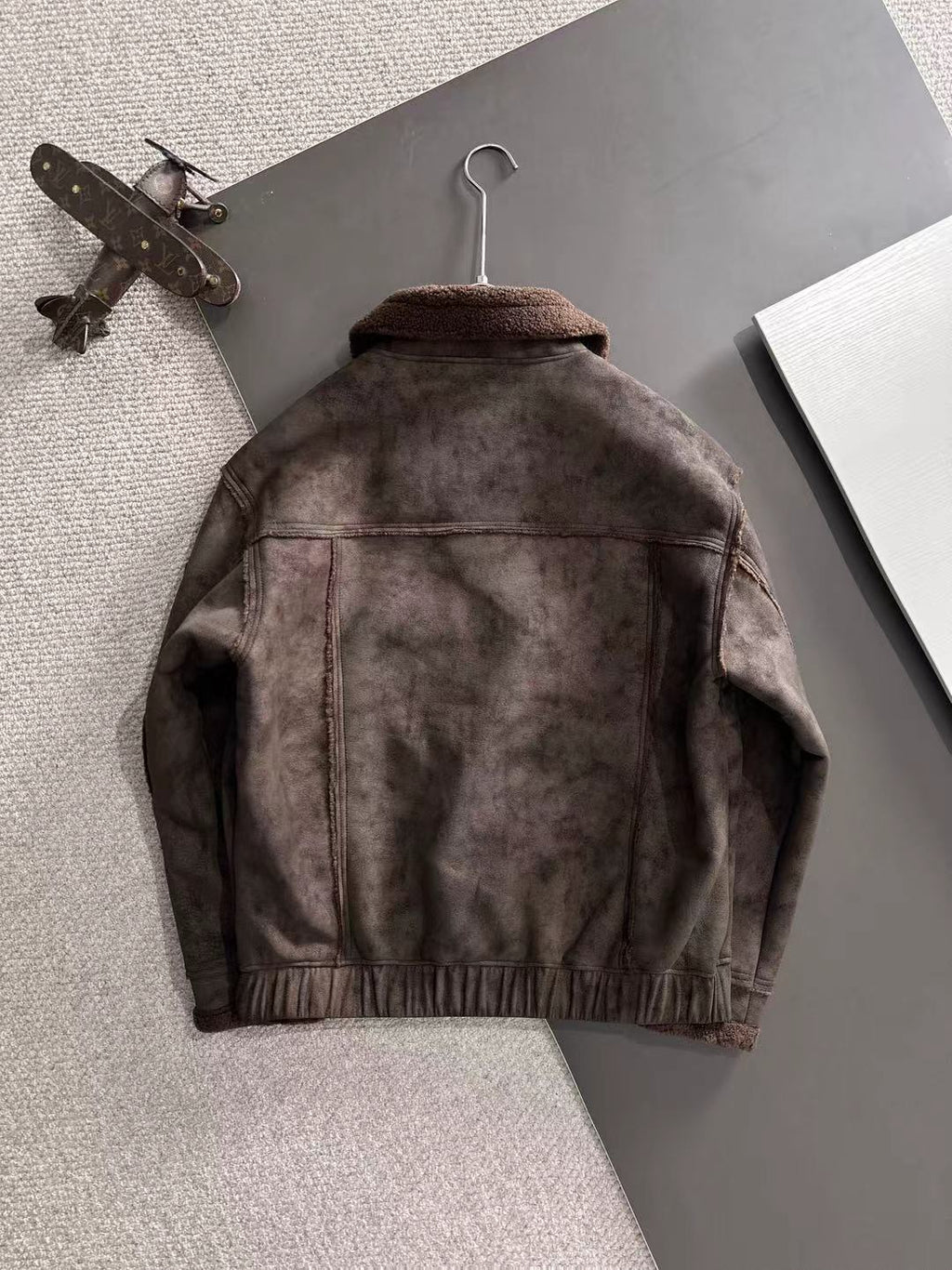 Brown jacket back with stand collar and ribbed hem trim
