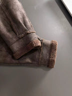 Brown shearling-lined cuffs on jacket with knit-style hem band