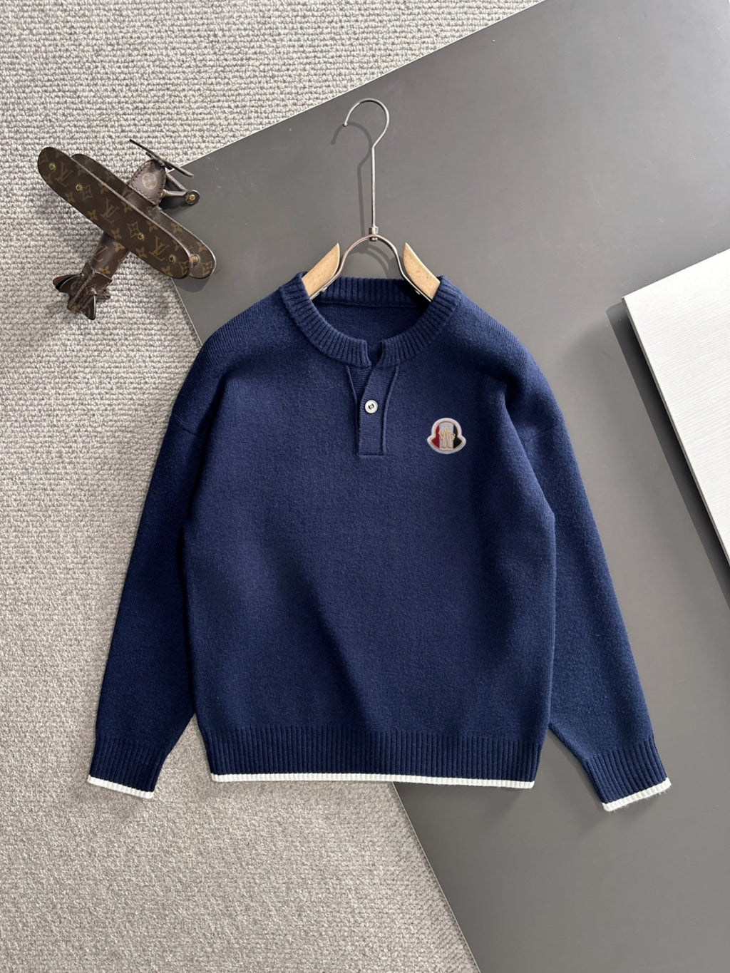 Moncler navy knit pullover with button placket and chest logo patch
