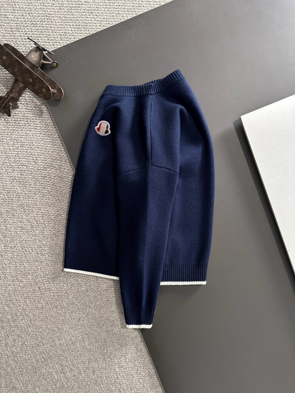 Moncler navy knit pullover with long sleeves and embroidered chest logo