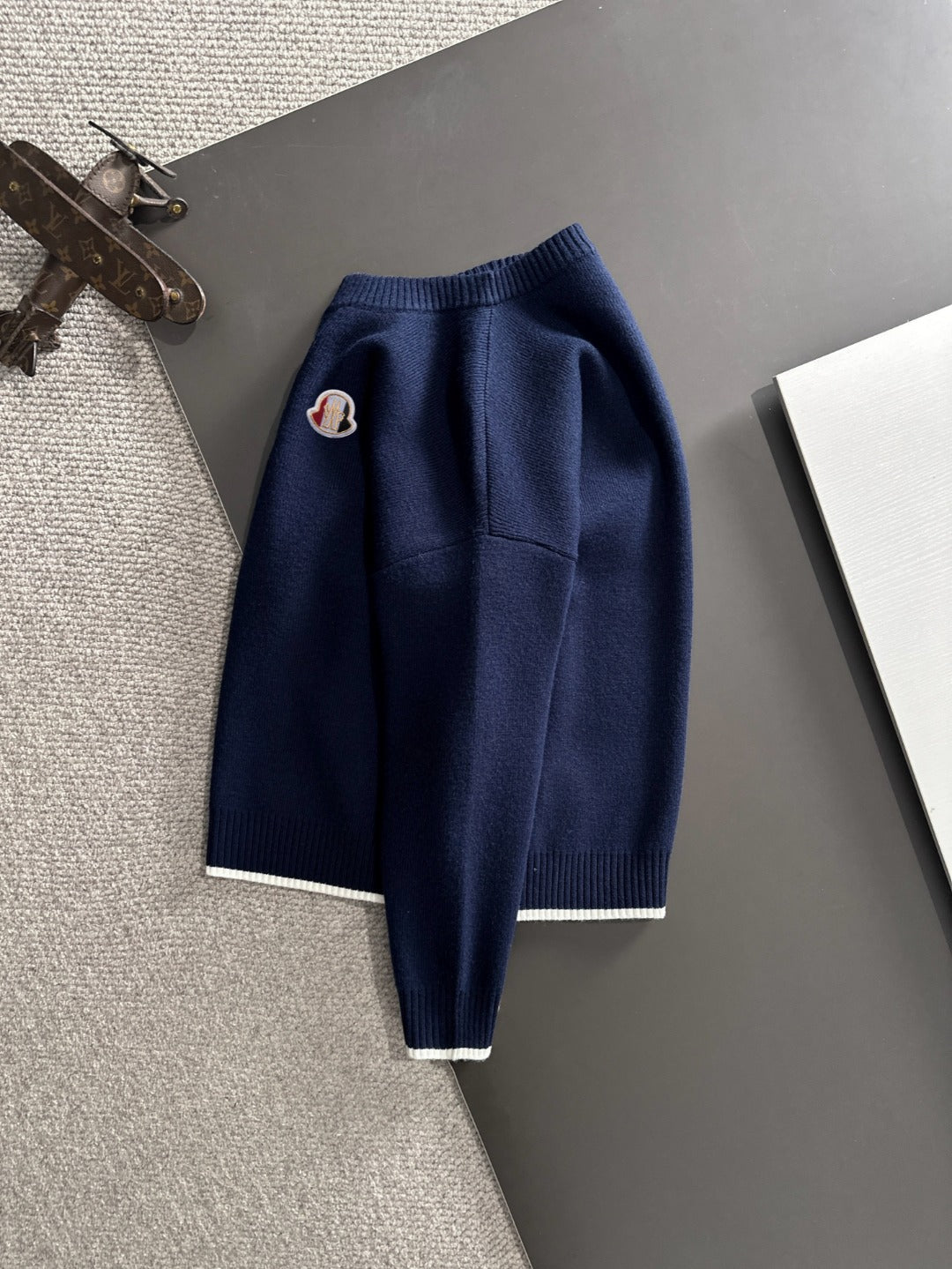 Moncler navy knit pullover with long sleeves and embroidered chest logo