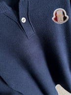 Moncler navy knit pullover detail: henley buttons and logo patch