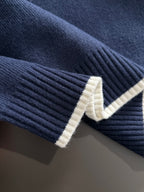 Moncler navy knit sleeve cuff with cream ribbed stripe