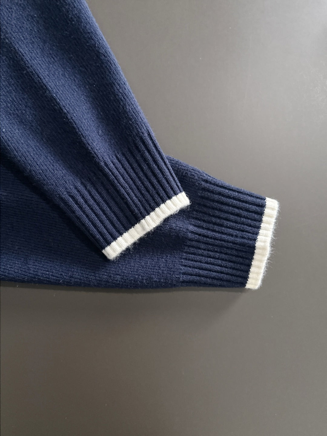 Moncler navy knit cuff with cream rib trim and sleeve edge