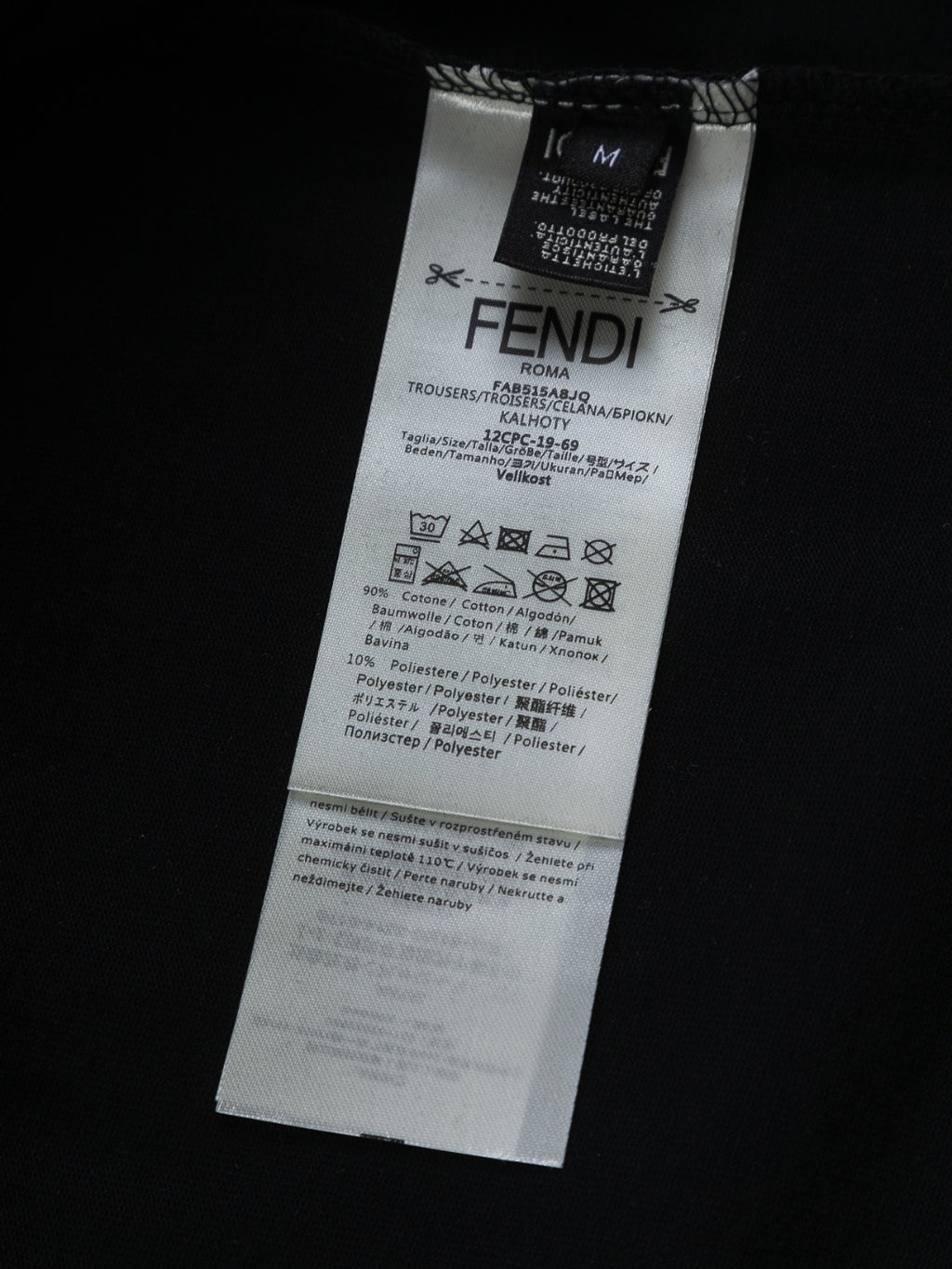 Fendi shorts care and size label on black fabric