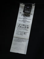 Fendi shorts care and size label on black fabric