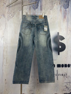 Blue denim pants with black graffiti print; belt loops and interior size tag