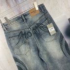 Blue denim jeans pants back detail: pockets, tag, and black graffiti print