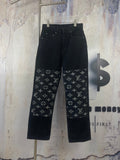 Black denim pants with white Louis Vuitton monogram print panels, button fly
