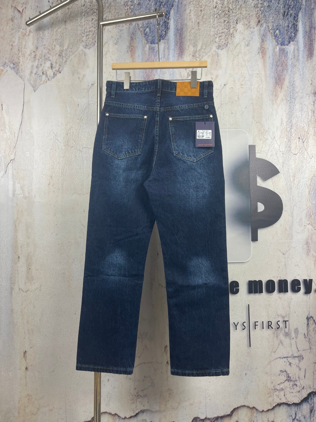 Louis Vuitton denim pants, dark blue wash, back view with stitched pockets