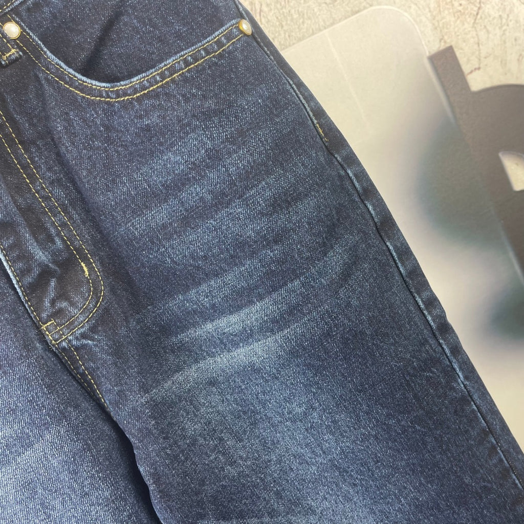 Louis Vuitton denim pants close-up, dark blue fabric with pocket seam stitching