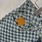 Louis Vuitton check denim pants, waistband detail with leather logo patch and pearl buttons