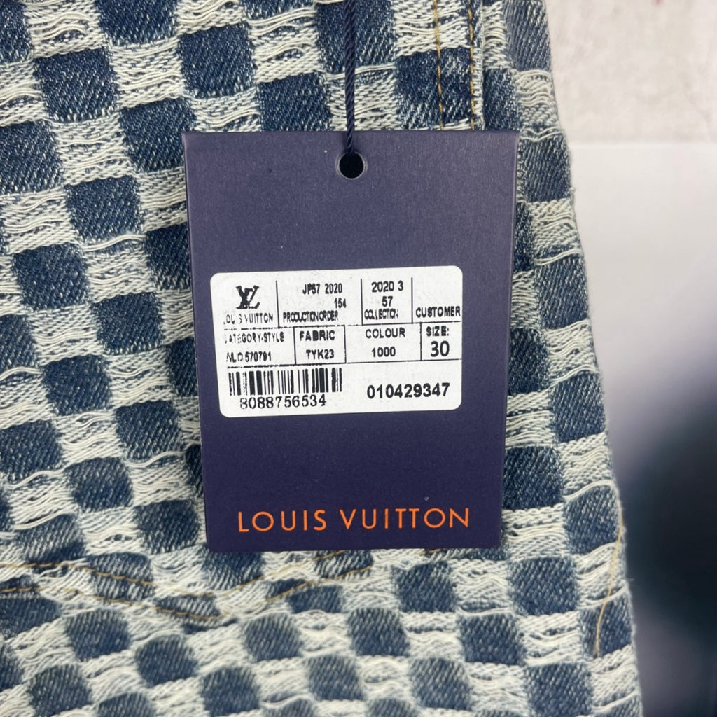 Louis Vuitton fabric care tag on blue-and-white check denim