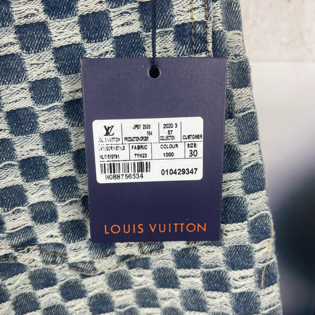 Louis Vuitton fabric care tag on blue-and-white check denim