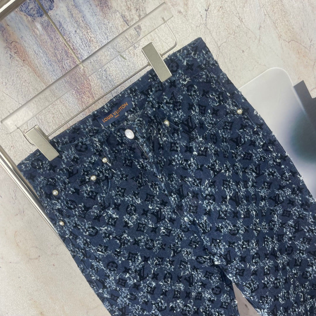 Louis Vuitton pants, dark blue allover monogram print, laid flat