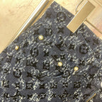 Louis Vuitton pants front detail, dark blue allover print with gold buttons