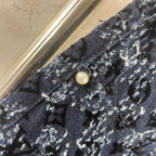 Louis Vuitton pants waistband detail, dark blue patterned fabric with button