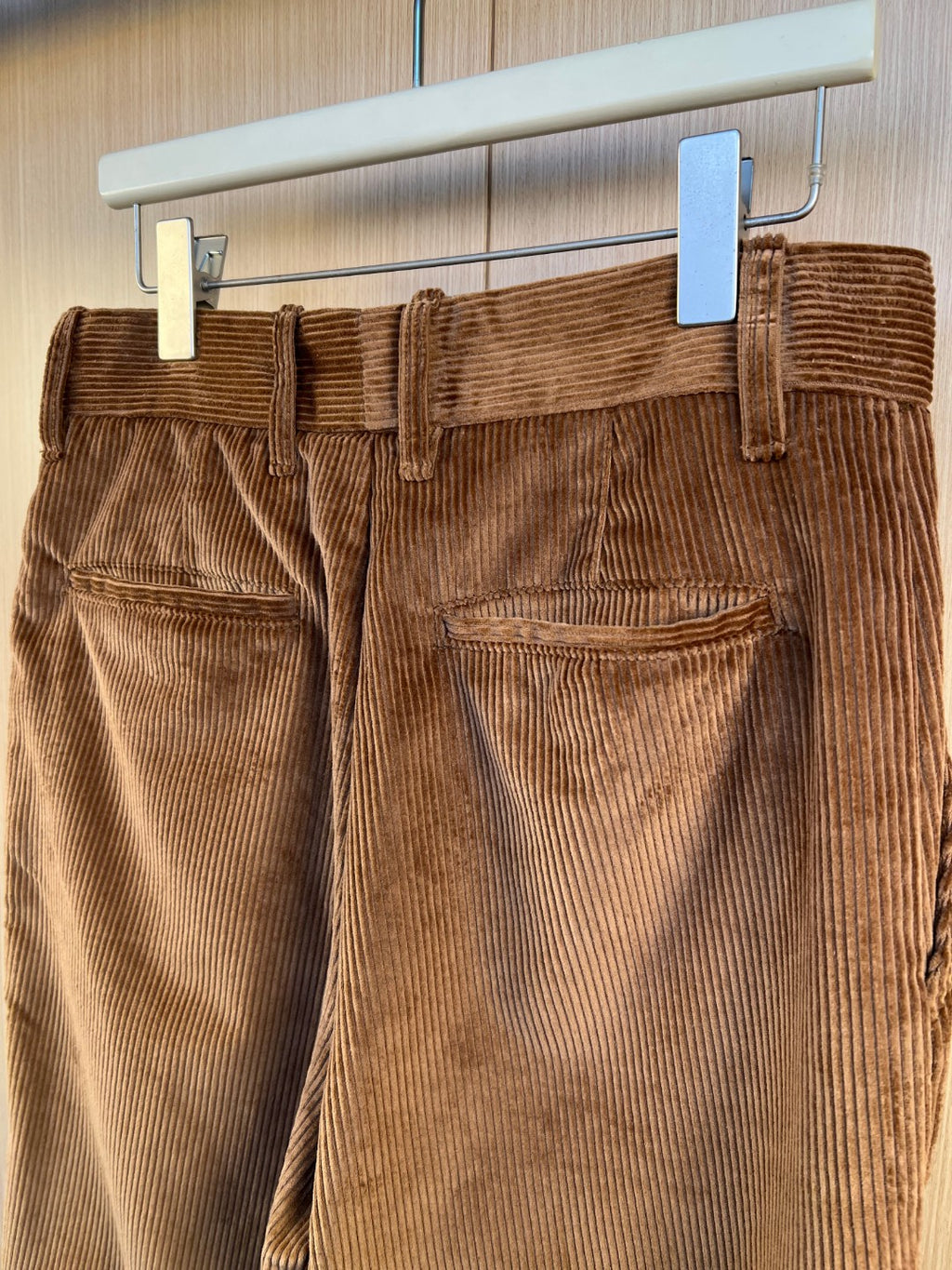 Corduroy pants back pocket and waistband seam detail