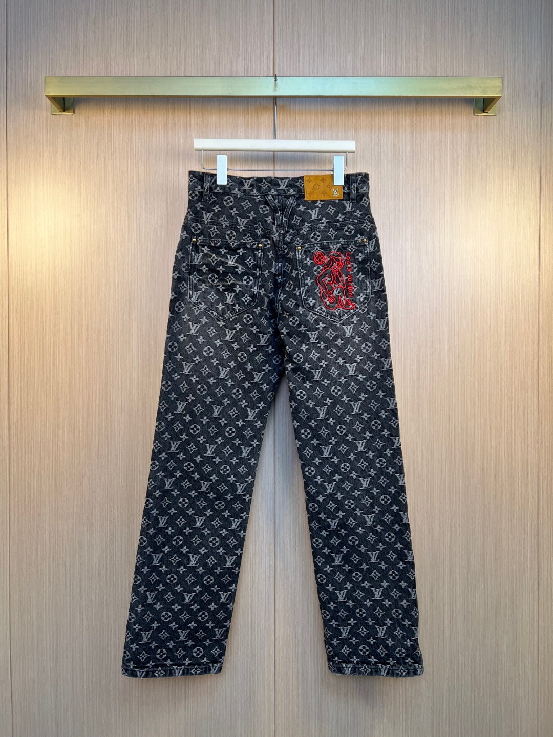 Louis Vuitton pants in dark denim with all-over monogram print and embroidered graphic