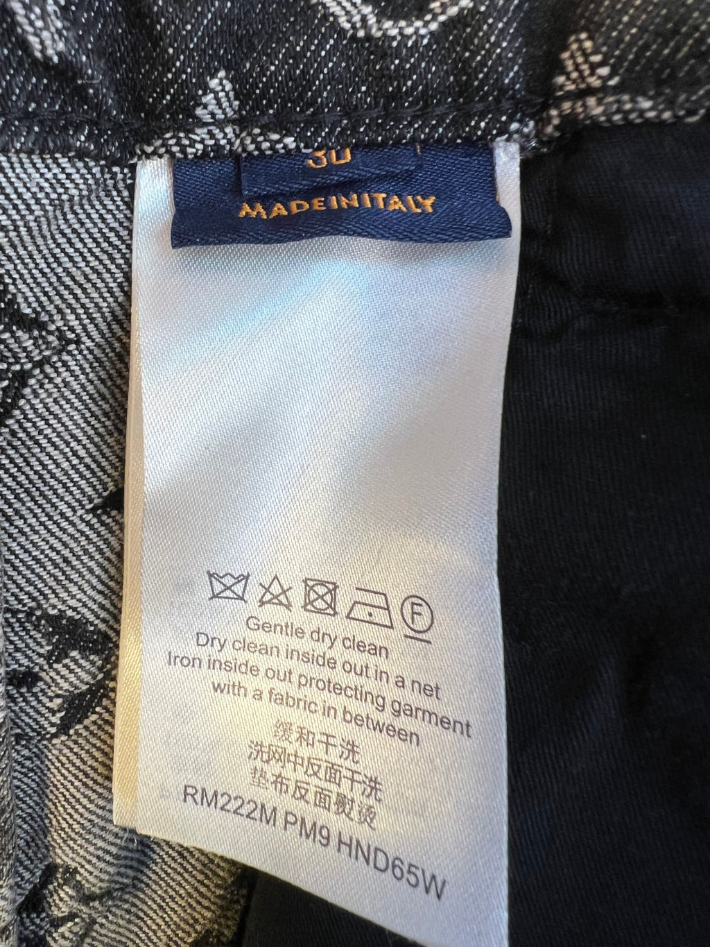 Louis Vuitton pants care label tag inside waistband with washing instructions