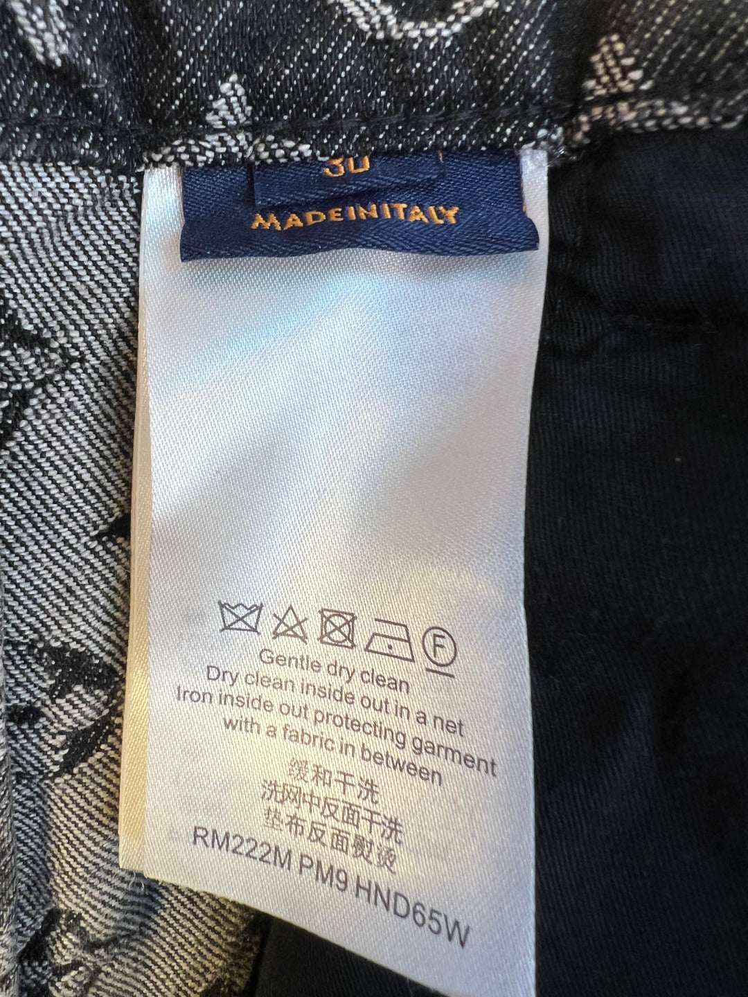 Louis Vuitton pants care label tag inside waistband with washing instructions
