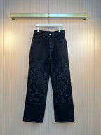 Louis Vuitton dark denim pants with monogram applique on lower legs