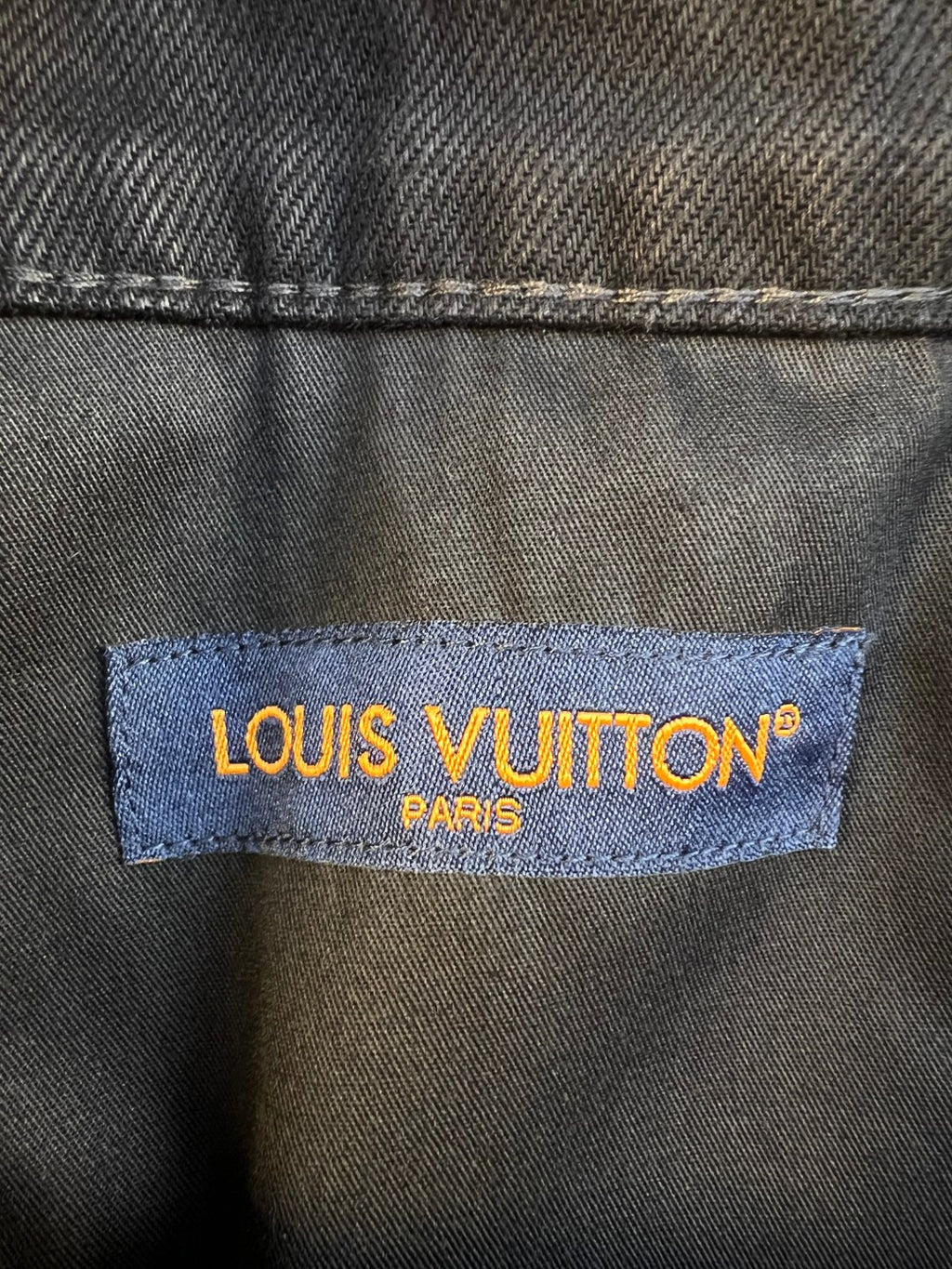 Louis Vuitton denim brand patch reading LOUIS VUITTON PARIS