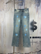 Light blue denim jeans with light blue lightning patches, five-pocket style