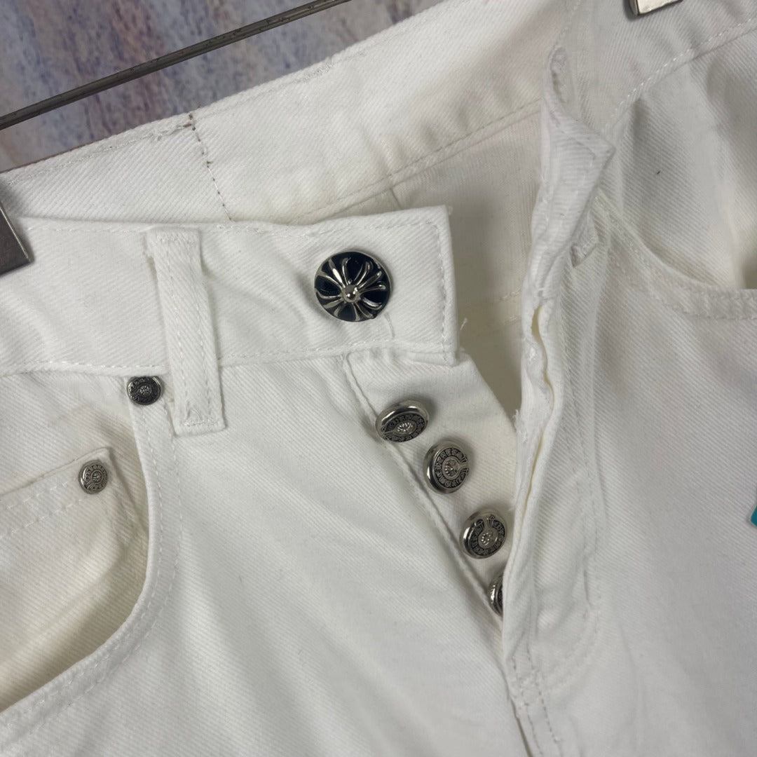 White denim pants front with metal buttons and belt loops