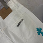 White denim pants back with side label and teal logo patch