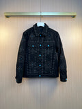 Dark denim jacket with studded embellishments and button front, long sleeves.