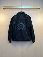 Dark denim jacket with large back stud and rhinestone motif, button front.