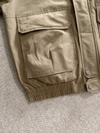 Lightweight jacket in tan with patch pocket and snap button