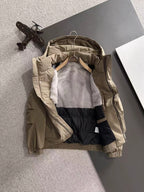 Lightweight hooded jacket with interior gray lining and black inner panel