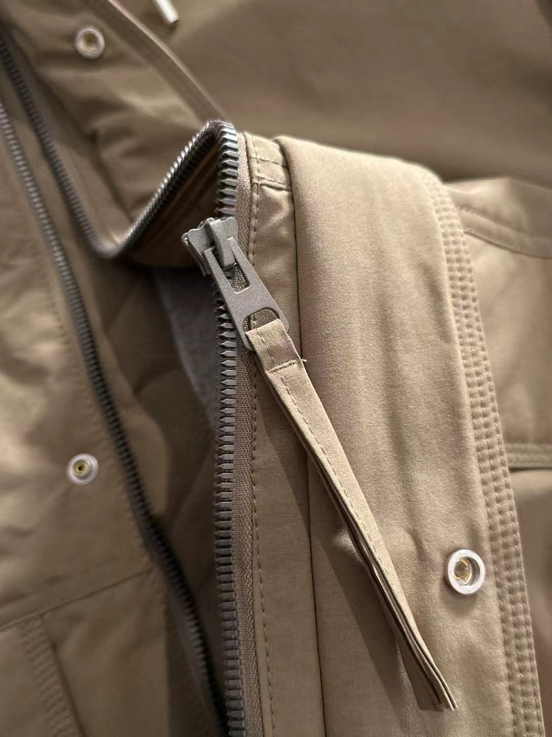 Lightweight hooded jacket in tan, front zipper with metal pull